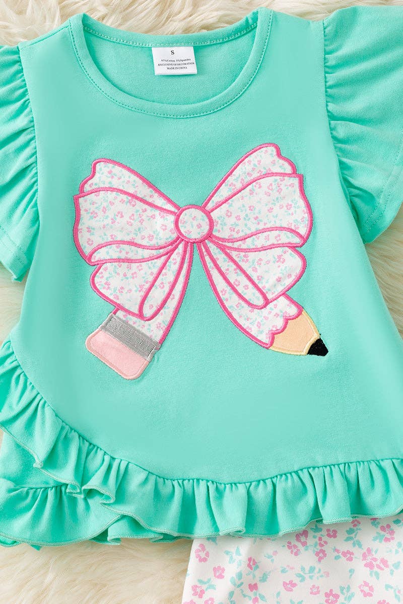 Pencil applique on mint top and floral shorts.  OFG60551