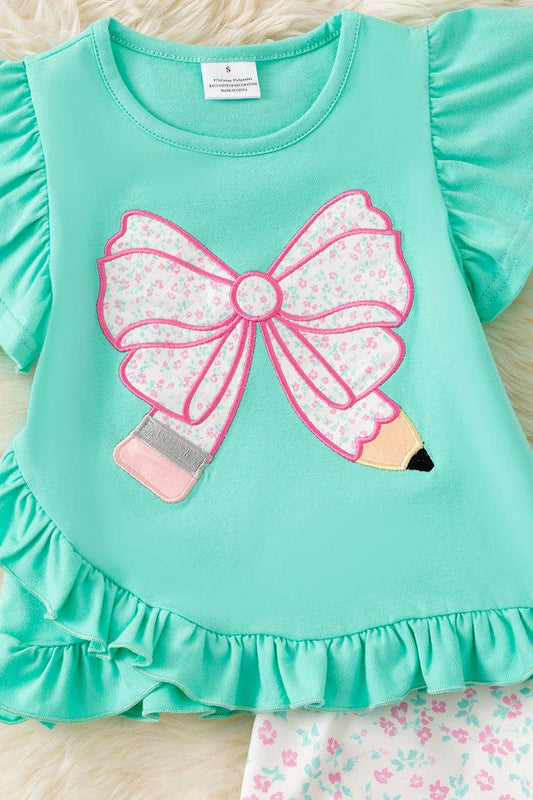 Pencil applique on mint top and floral shorts.  OFG60551
