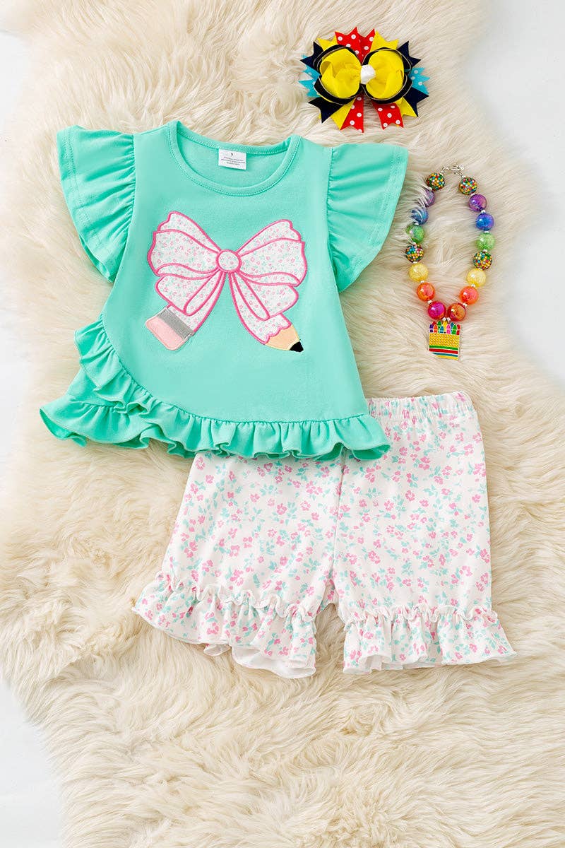 Pencil applique on mint top and floral shorts.  OFG60551
